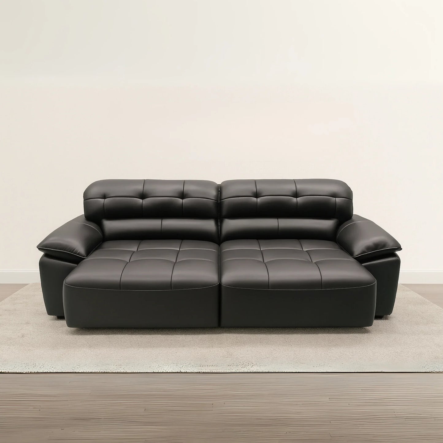 Black leather sectional sofa on a beige carpet with a plain wall background