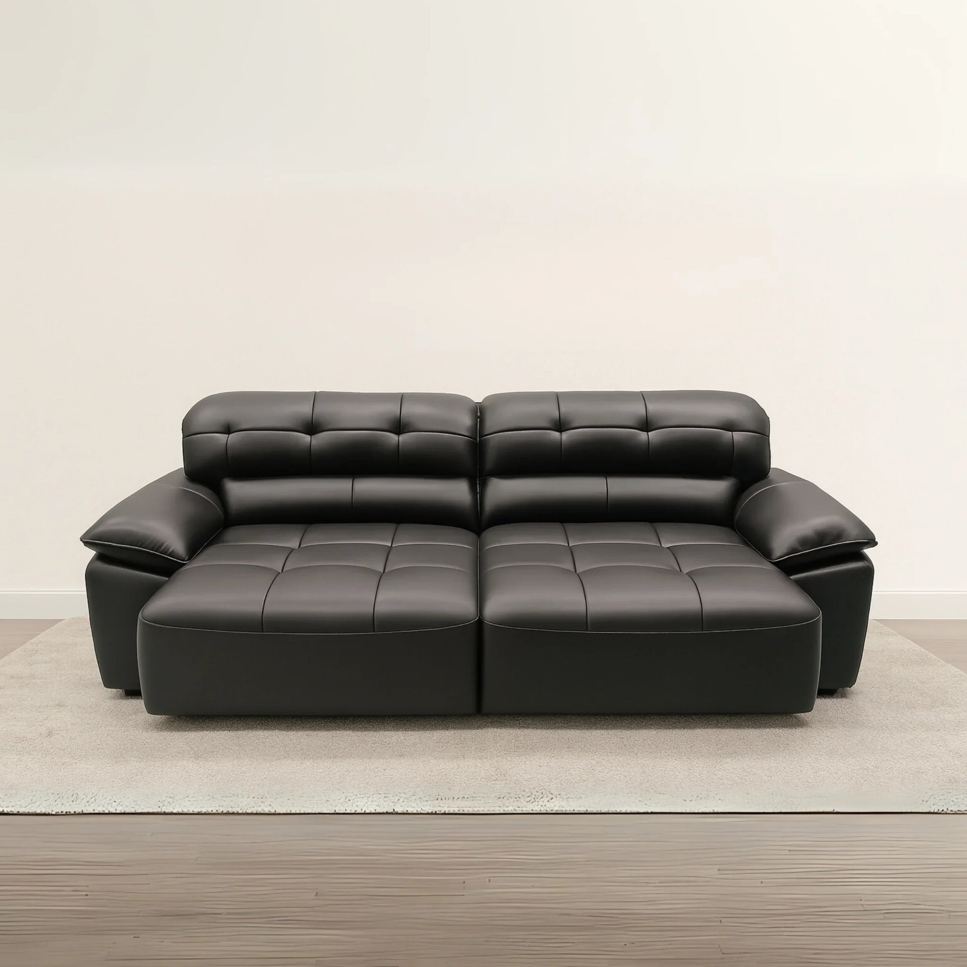 Black leather sectional sofa on a beige carpet with a plain wall background