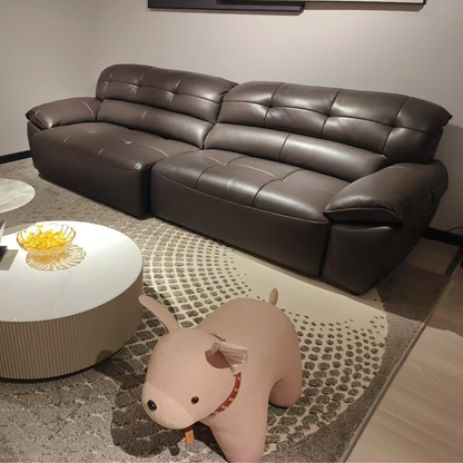 Brown leather sectional sofa in a living room setting with a coffee table and decorative items.
