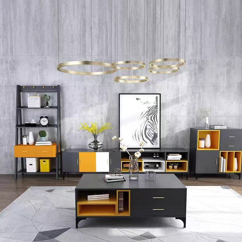 Modern living room with gray walls, a black and orange coffee table, and decorative items.