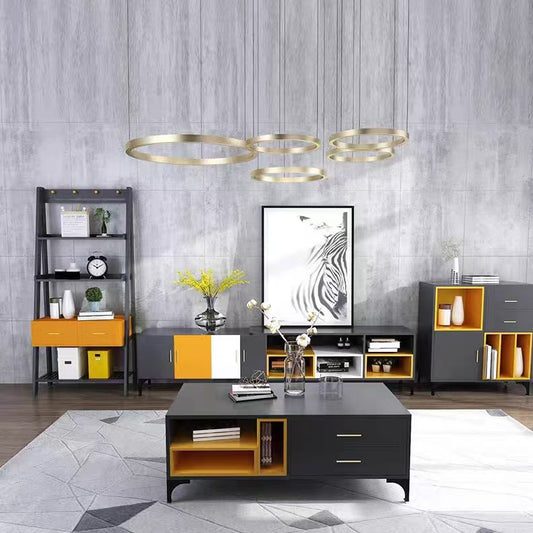 Modern living room with gray walls, a black and orange coffee table, and decorative items.