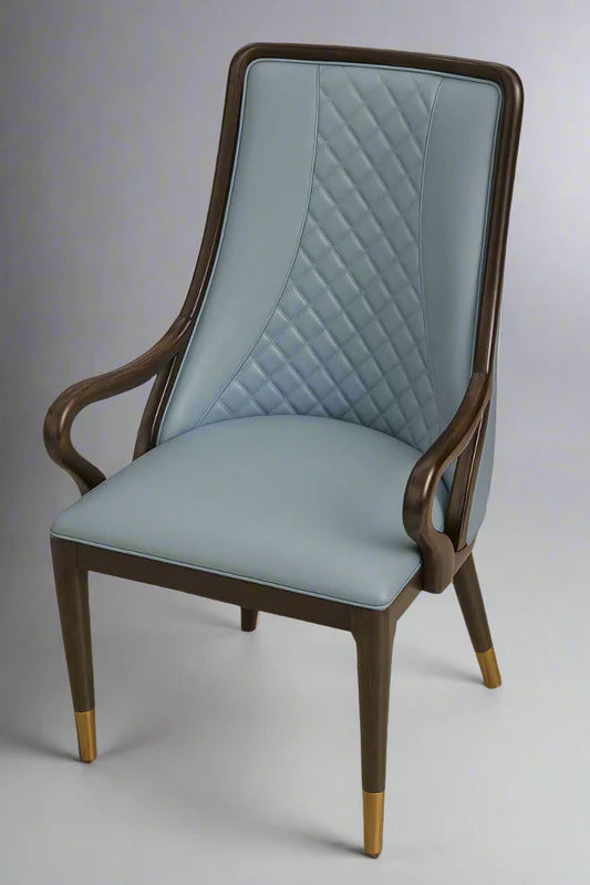 Front view of classic blue PU leather dining chair with quilted diamond stitching, wooden armrests, and gold-tipped legs