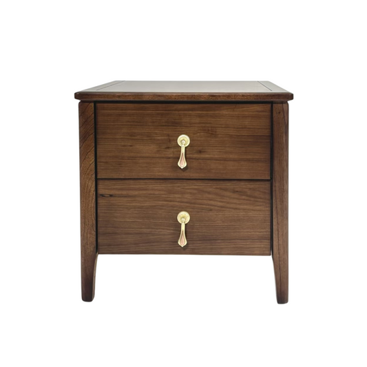 Wooden nightstand with two drawers and brass handles on a white background