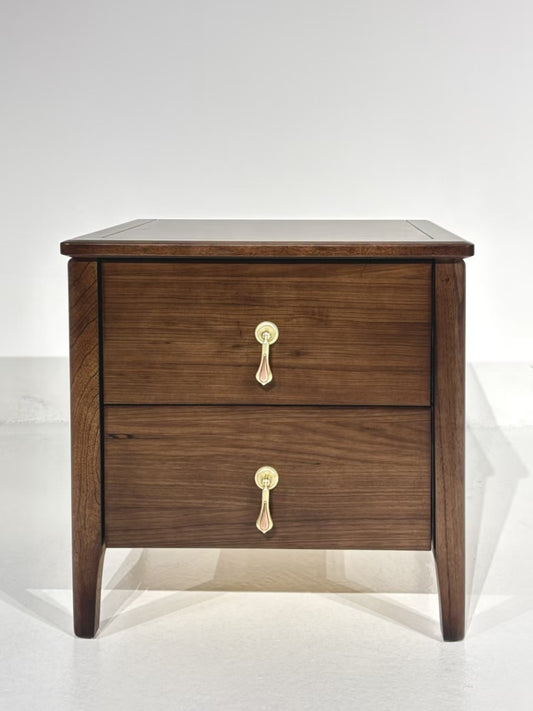 Classic walnut wood nightstand with two brass-handled drawers and tapered legs – perfect for elegant bedrooms.