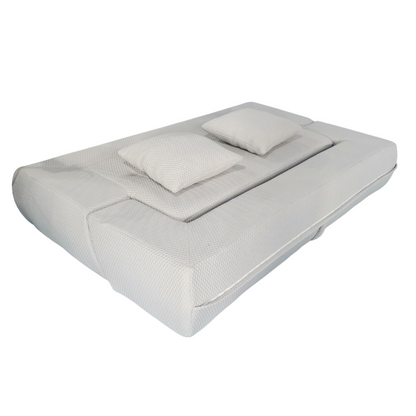 Gray futon sofa with pillows on a white background