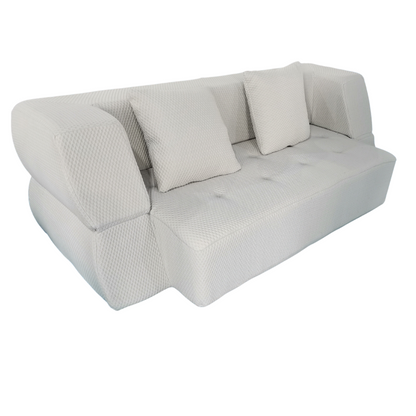 Gray sofa with textured surface and three cushions on a white background