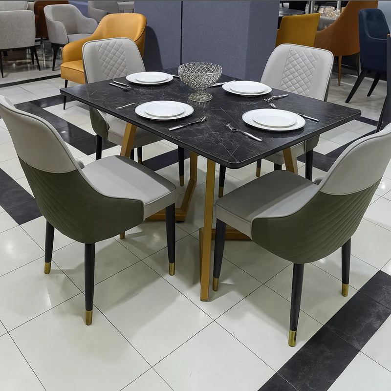 Side view of Diamond Luxe PU leather chair showcasing quilted upholstery, ergonomic backrest, and brass-tipped wooden legs