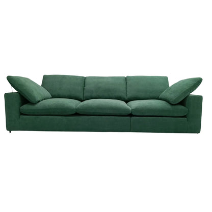 Green sofa with three cushions on a white background