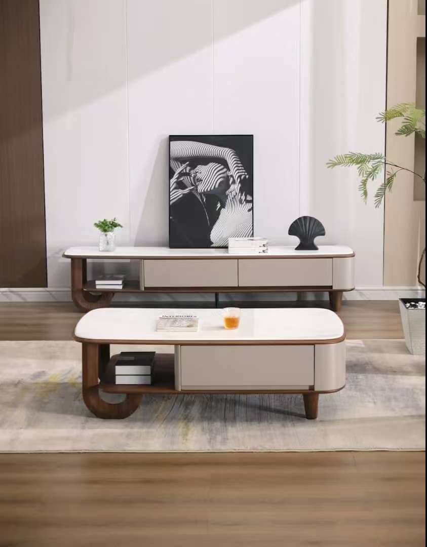 Modern living room with a coffee table and decorative items.