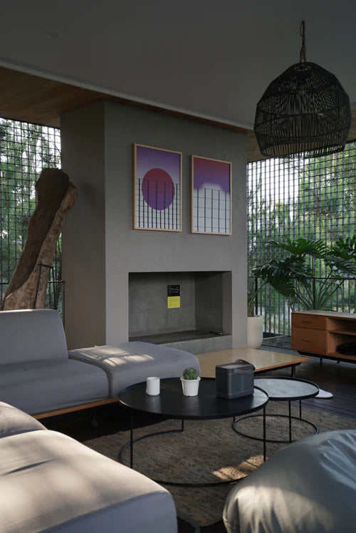 Designer living room furniture in a bright space with natural light through a window