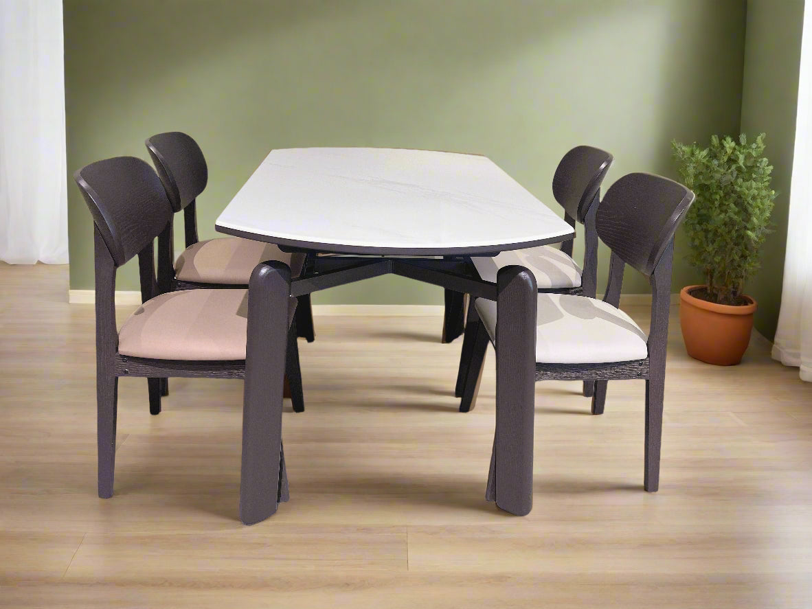 Dining table set with six chairs in a room with a light-colored wall.