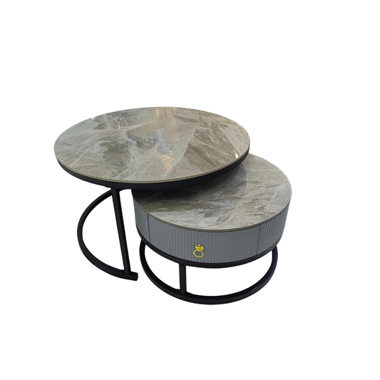 Set of two round marble coffee tables with black metal legs on a white background