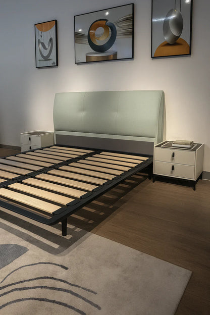 Modern pastel green upholstered bed with black legs