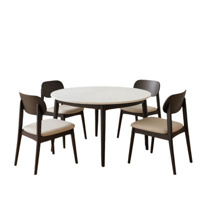 Round white table with four dark wooden chairs on a white background
