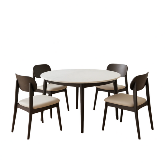Round white table with four dark wooden chairs on a white background