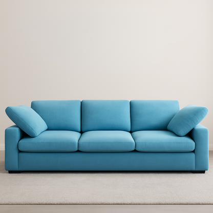 Blue sofa with cushions on a plain background